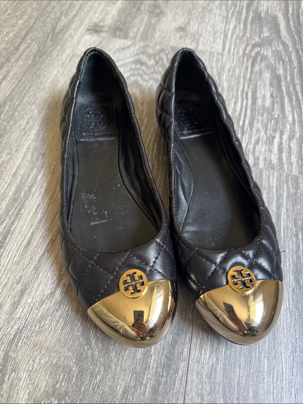 Tory Burch Black Quilted Leather Flats with Gold Cap Toe Logo